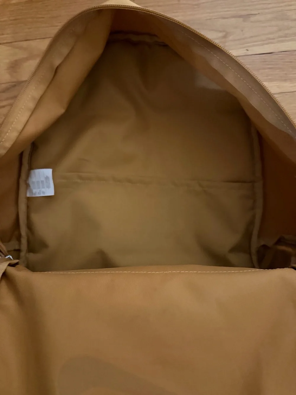 Nike Tan Backpack with White Swoosh Logo